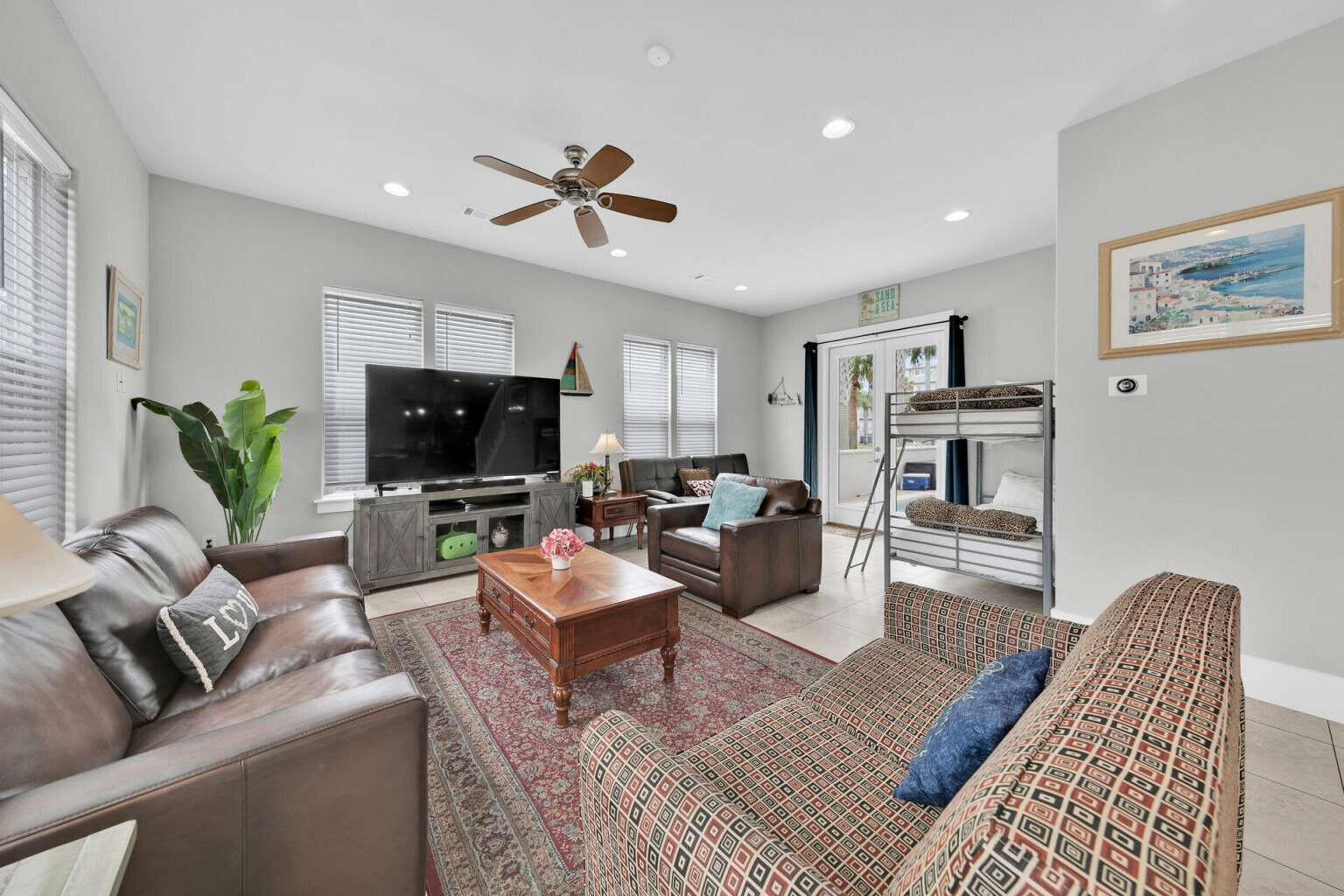 228 Miami Street Miramar Beach, FL 32550 - Photo 3 of 20 a living room with furniture ceiling fan and a rug