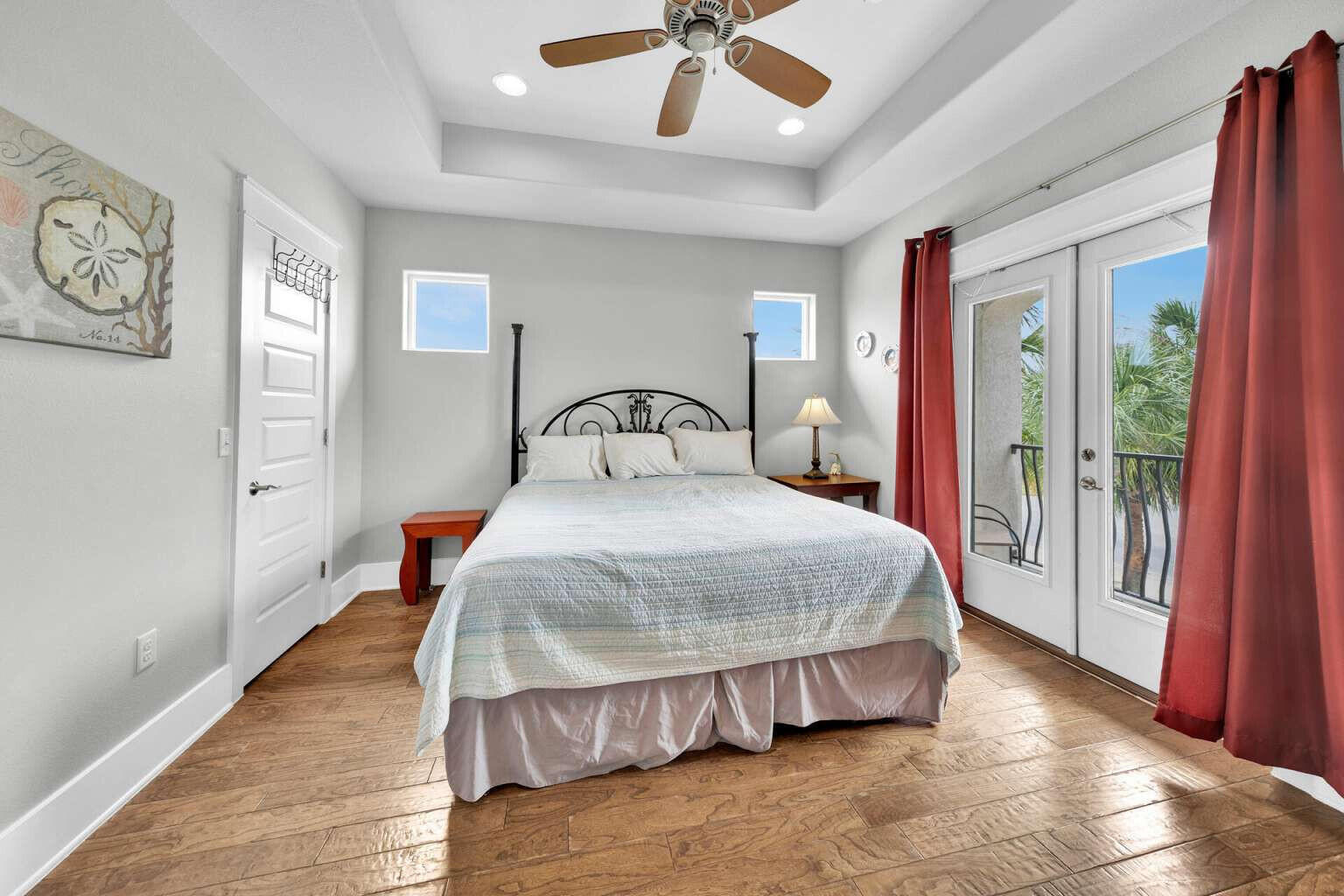 228 Miami Street Miramar Beach, FL 32550 - Photo 10 of 20 a bedroom with a large bed and a chandelier