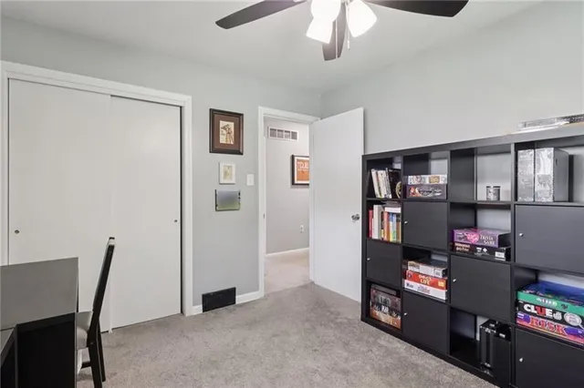 a view of a workspace with furniture