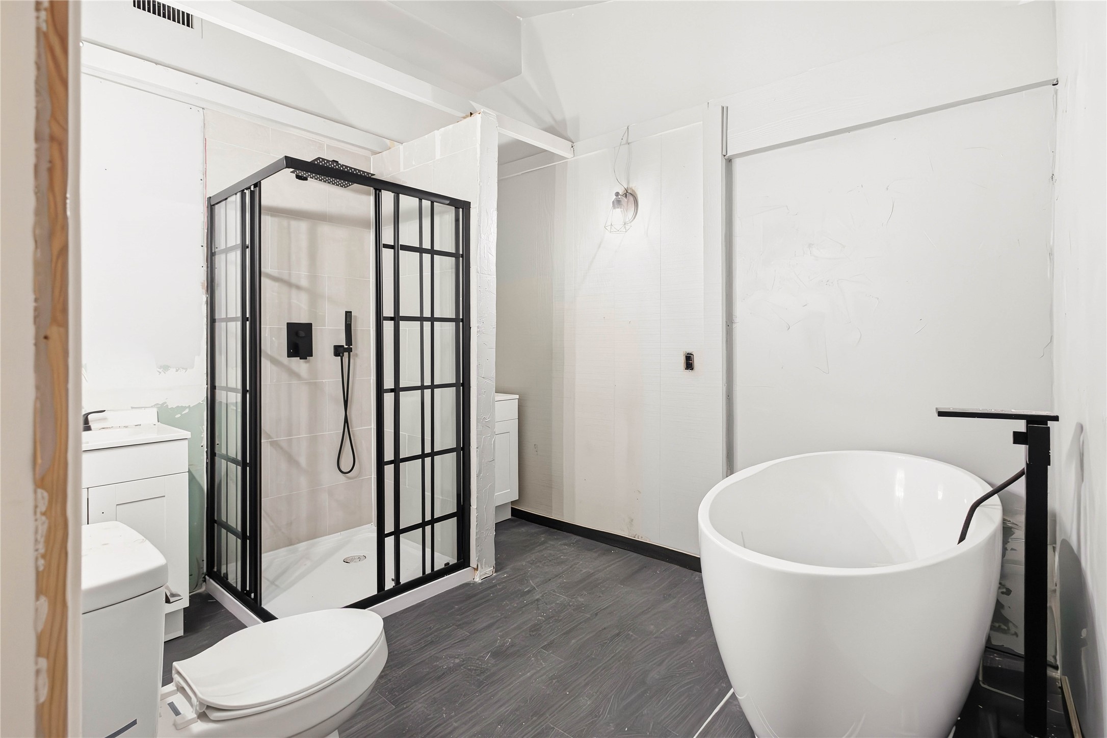 5910 Zenith Street Beaumont, TX 77706 - Photo 12 of 36 a bathroom with a white tub shower and toilet