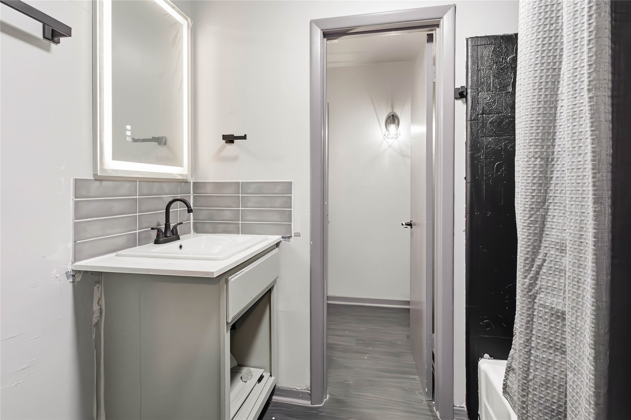 5910 Zenith Street Beaumont, TX 77706 - Photo 20 of 36 a bathroom with a sink and a mirror