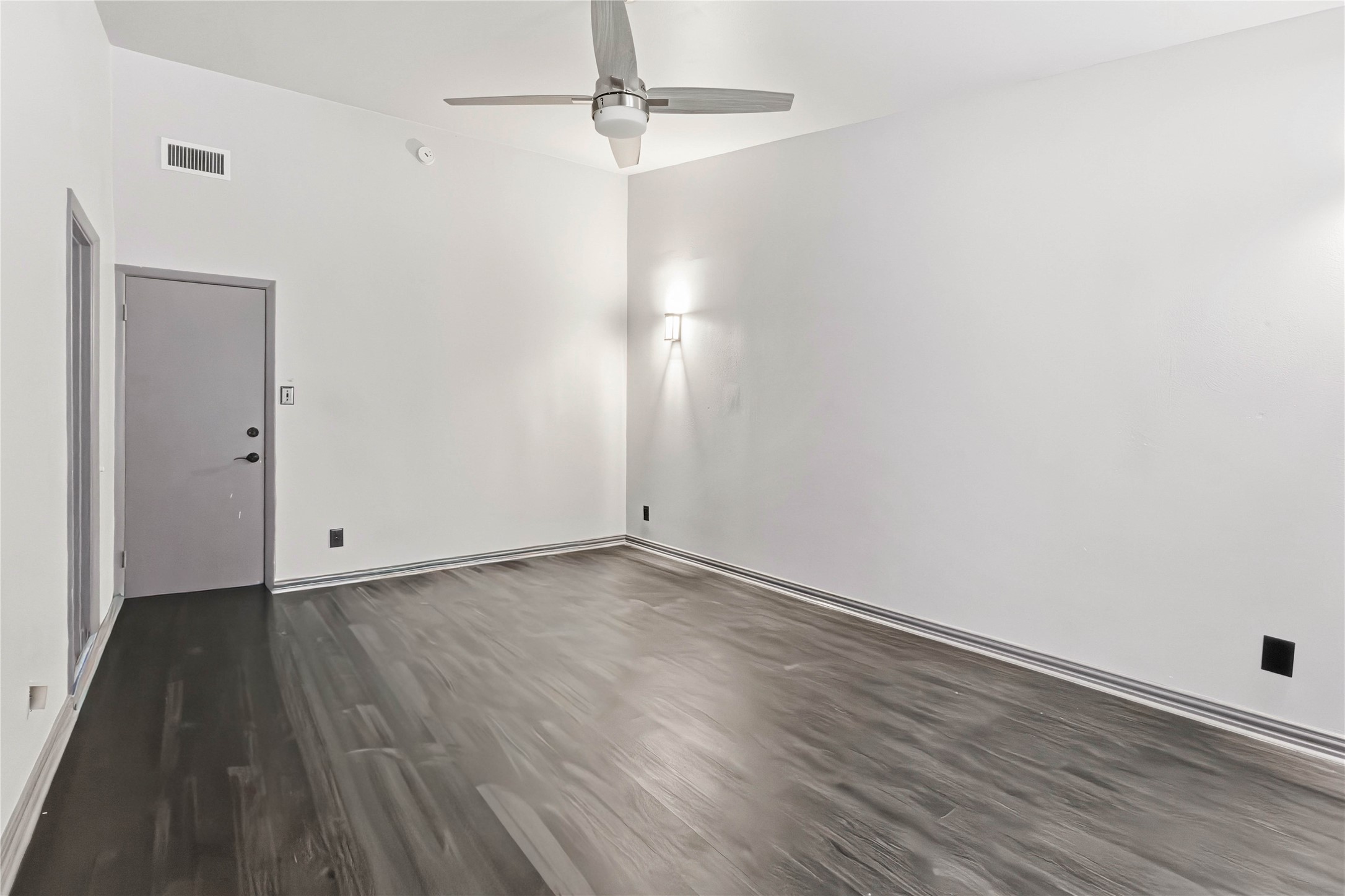 5910 Zenith Street Beaumont, TX 77706 - Photo 24 of 36 a view of an empty room with wooden floor