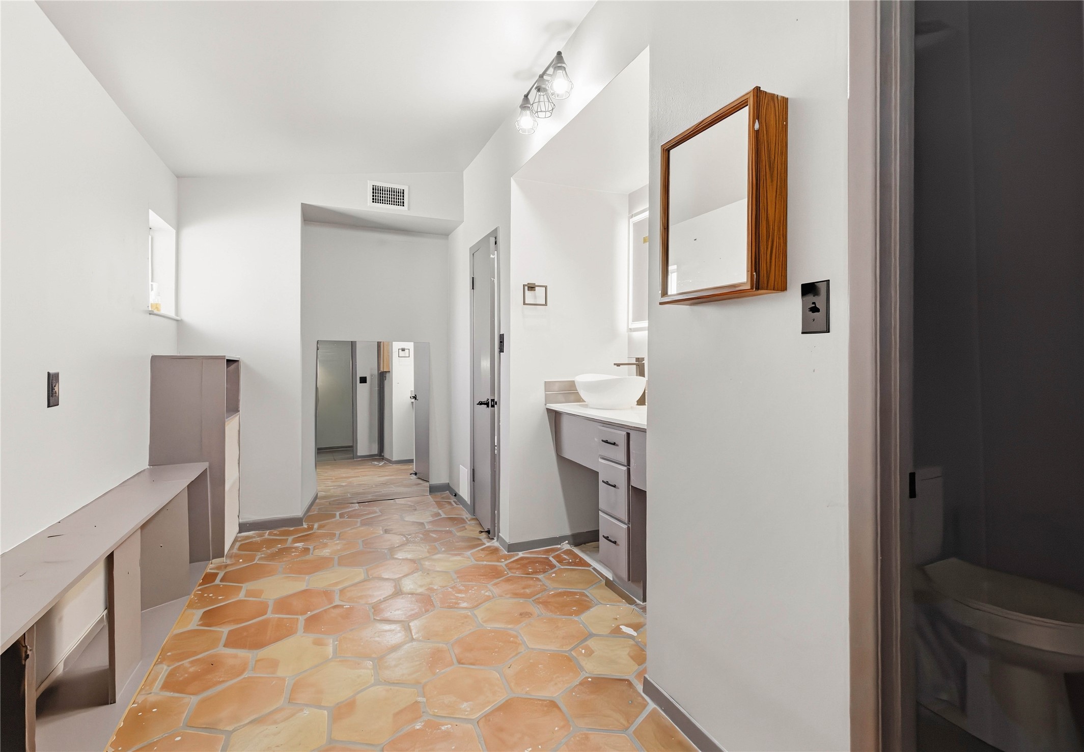 5910 Zenith Street Beaumont, TX 77706 - Photo 26 of 36 a bathroom with a sink toilet and shower