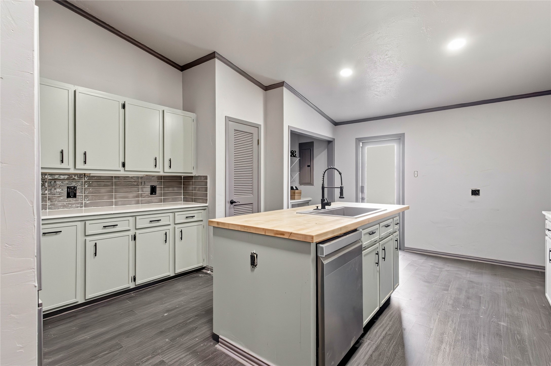 5910 Zenith Street Beaumont, TX 77706 - Photo 29 of 36 a kitchen with granite countertop a sink and a stove top oven