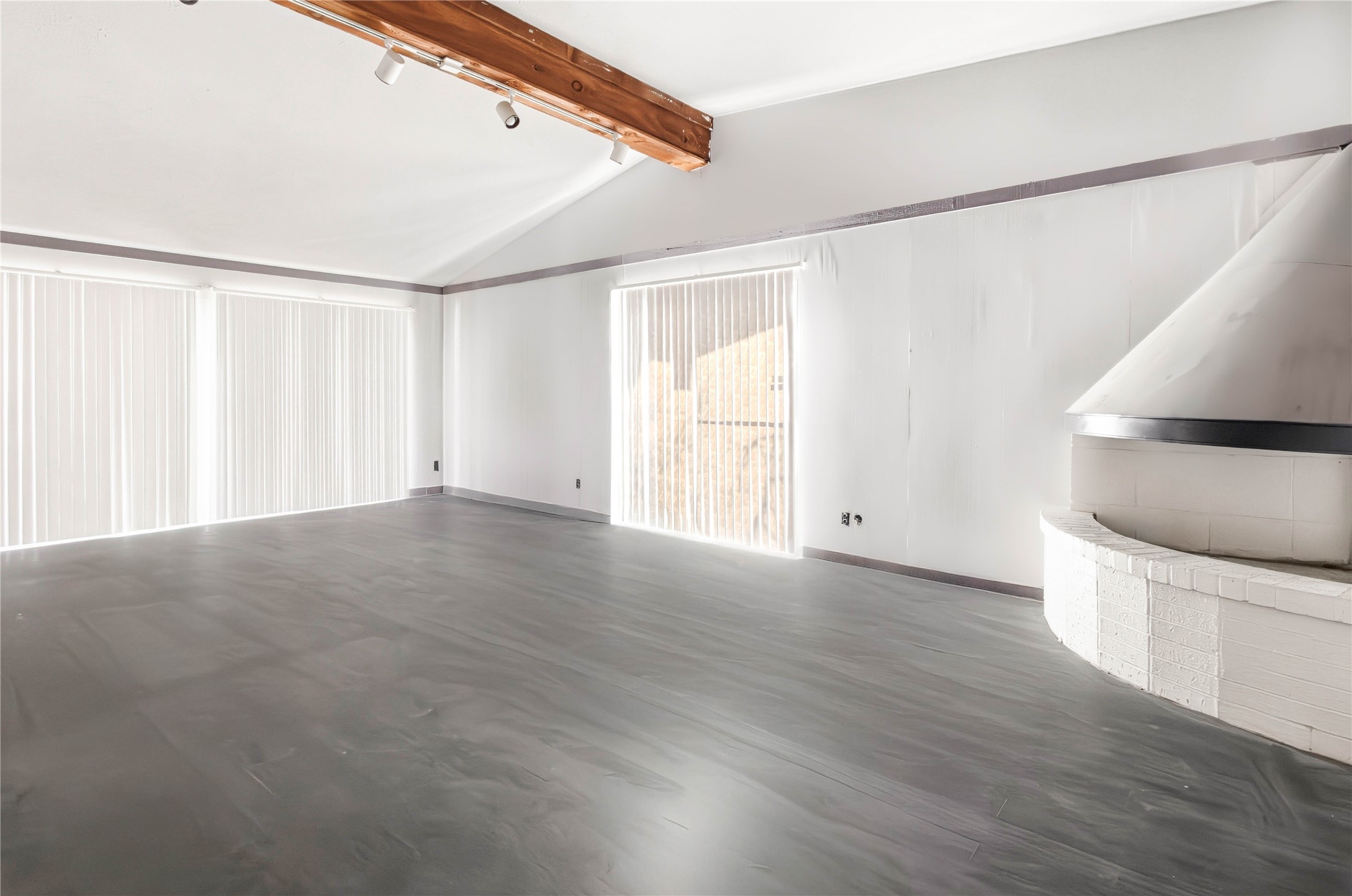 5910 Zenith Street Beaumont, TX 77706 - Photo 9 of 36 a view of an empty room with a window and wooden floor