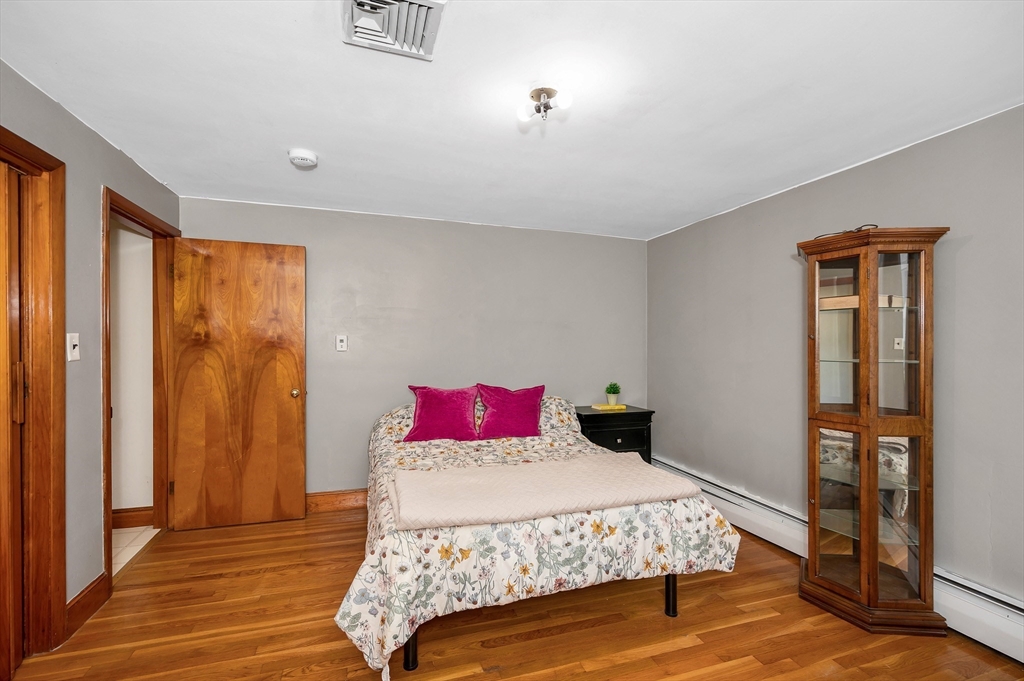 7 Marie Street Methuen, MA 01844 - Photo 13 of 39 a bedroom with a bed and wooden floor