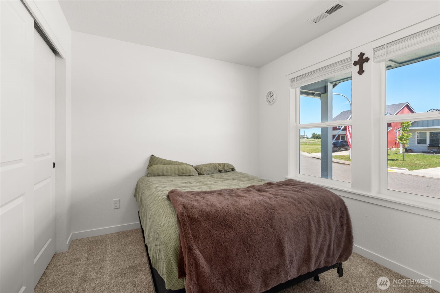 401 Cardinal Avenue Winlock, WA 98596 - Photo 18 of 39 a bed sitting in a bedroom next to a window