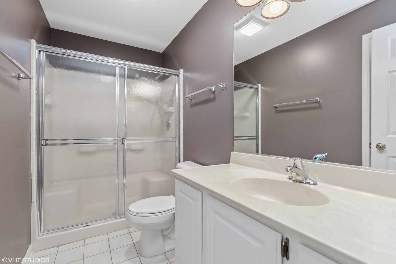 256 Haber Court, Unit 256 Cary, IL 60013 - Photo 11 of 12 a bathroom with a sink toilet and shower