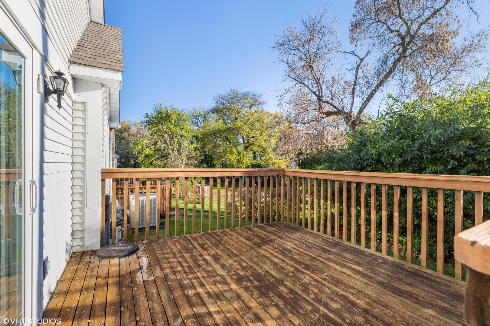 256 Haber Court, Unit 256 Cary, IL 60013 - Photo 12 of 12 a view of balcony with wooden floor and fence