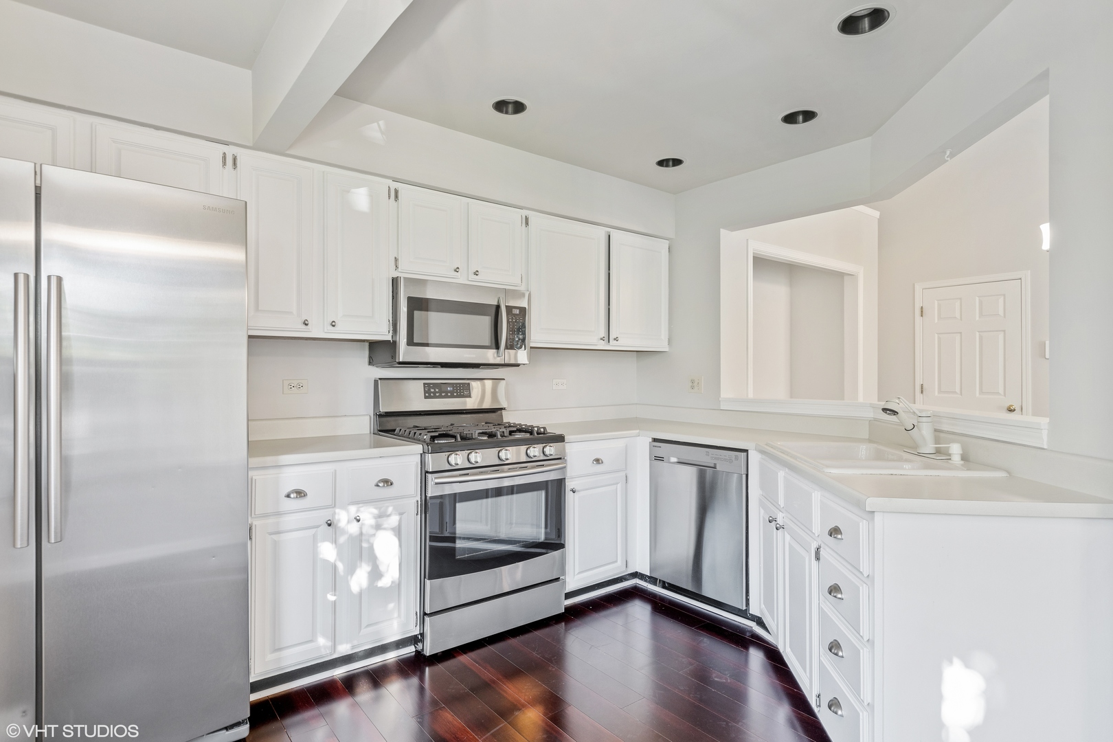 256 Haber Court, Unit 256 Cary, IL 60013 - Photo 4 of 12 a kitchen with stainless steel appliances granite countertop a refrigerator a stove a sink and white cabinets