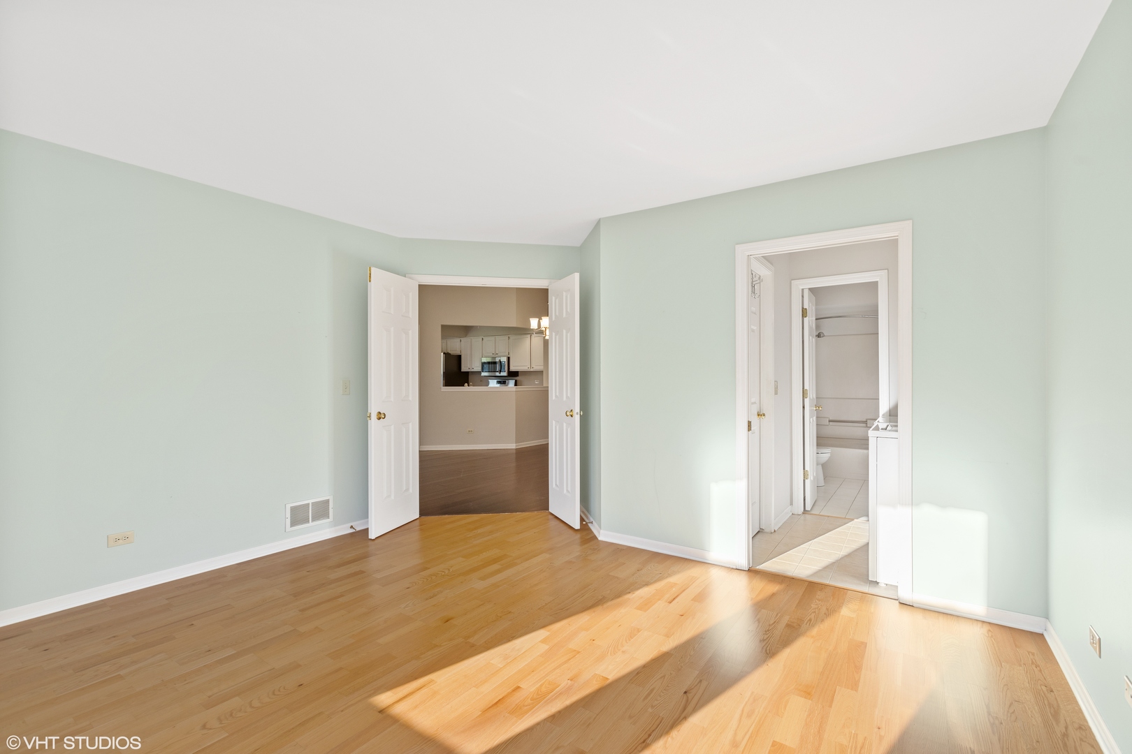 256 Haber Court, Unit 256 Cary, IL 60013 - Photo 7 of 12 a bedroom with a bed and wooden floor