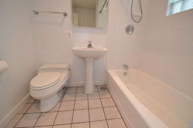 3239 North Leavitt Street, Unit 2 Chicago, IL 60618 - Photo 11 of 12 a bathroom with a sink a toilet and bathtub