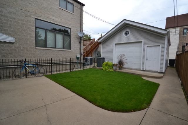 3239 North Leavitt Street, Unit 2 Chicago, IL 60618 - Photo 12 of 12 a view of outdoor space yard and front view of a house