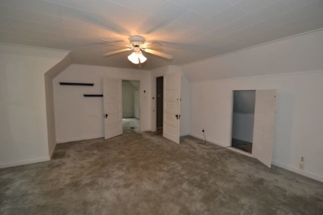 3239 North Leavitt Street, Unit 2 Chicago, IL 60618 - Photo 4 of 12 an empty room with closet and a chandelier fan