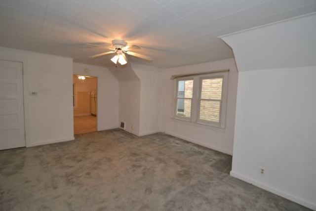 3239 North Leavitt Street, Unit 2 Chicago, IL 60618 - Photo 6 of 12 an empty room with fan and windows