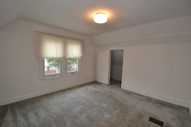 3239 North Leavitt Street, Unit 2 Chicago, IL 60618 - Photo 7 of 12 an empty room with windows and closet