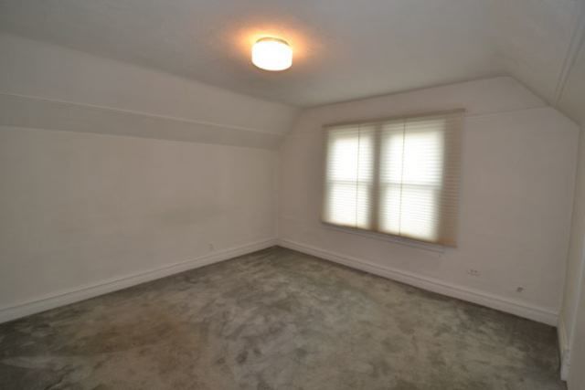 3239 North Leavitt Street, Unit 2 Chicago, IL 60618 - Photo 8 of 12 an empty room with a window