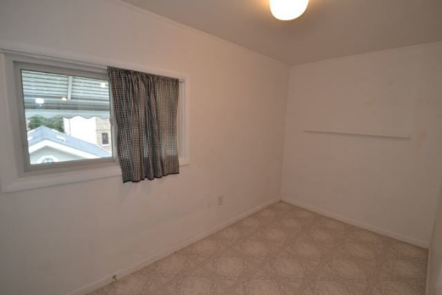 3239 North Leavitt Street, Unit 2 Chicago, IL 60618 - Photo 10 of 12 an empty room with a window