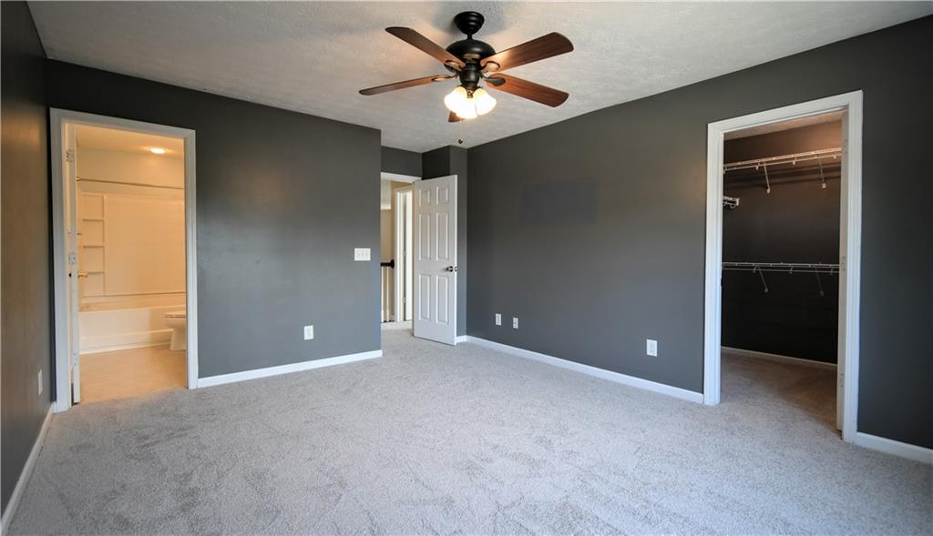 6215 Smoke Ridge Lane Cumming, GA 30041 - Photo 21 of 32 wooden floor and window in an empty room