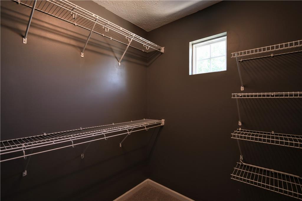 6215 Smoke Ridge Lane Cumming, GA 30041 - Photo 24 of 32 a view of a room with rack on the wall