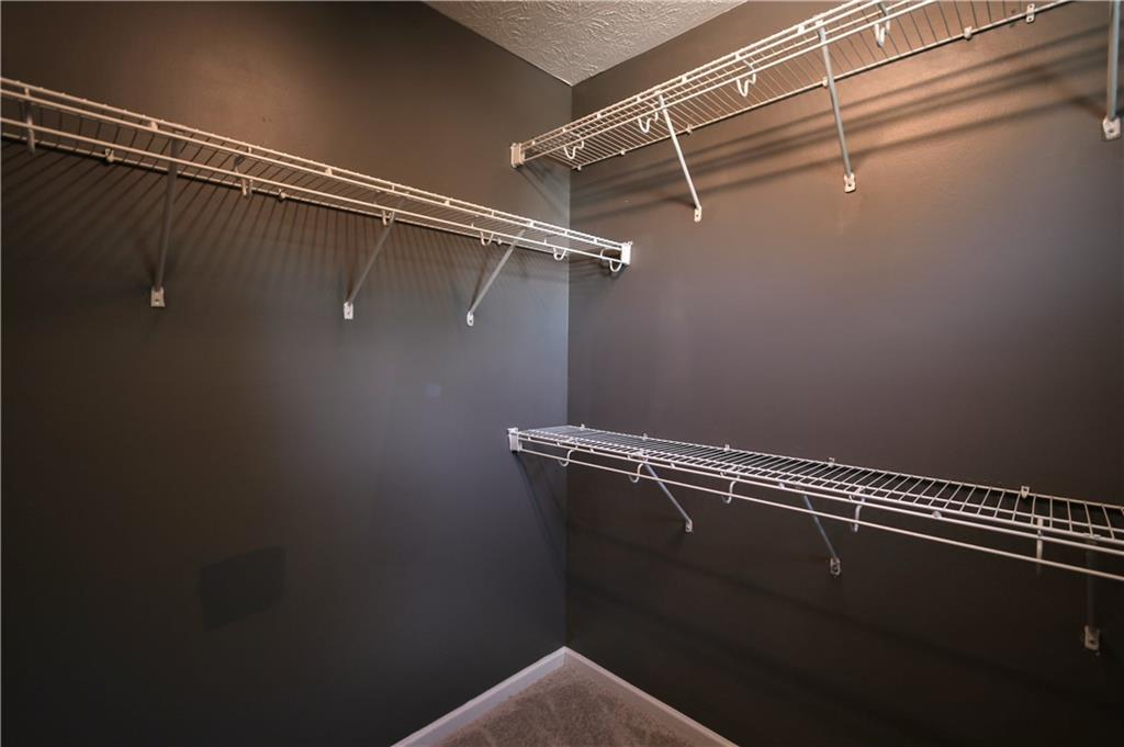 6215 Smoke Ridge Lane Cumming, GA 30041 - Photo 25 of 32 a view of a room with racks on the wall