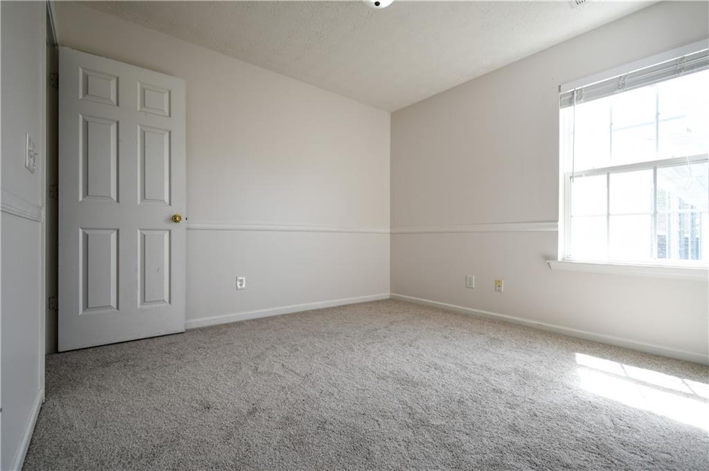 6215 Smoke Ridge Lane Cumming, GA 30041 - Photo 27 of 32 an empty room with windows