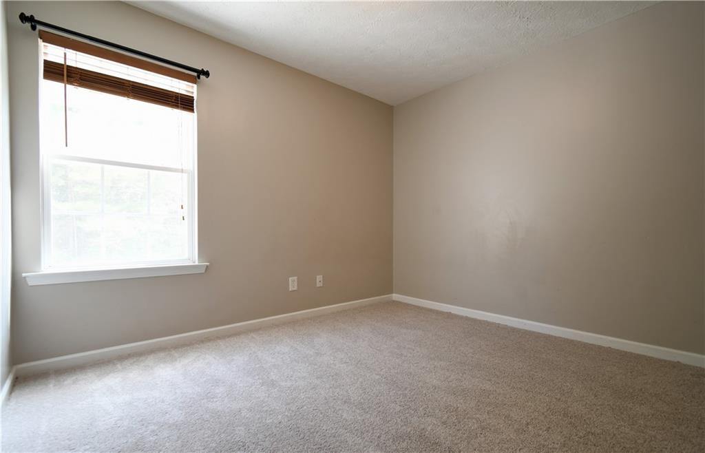 6215 Smoke Ridge Lane Cumming, GA 30041 - Photo 30 of 32 an empty room with a window