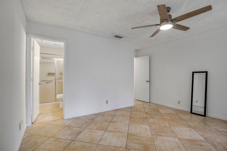 540 Shady Pine Way, Unit B Greenacres, FL 33415 - Photo 20 of 30 Main Bedroom and Bathroom