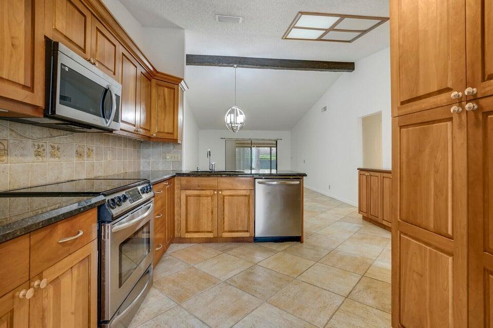 540 Shady Pine Way, Unit B Greenacres, FL 33415 - Photo 6 of 30 Kitchen to Greatroom