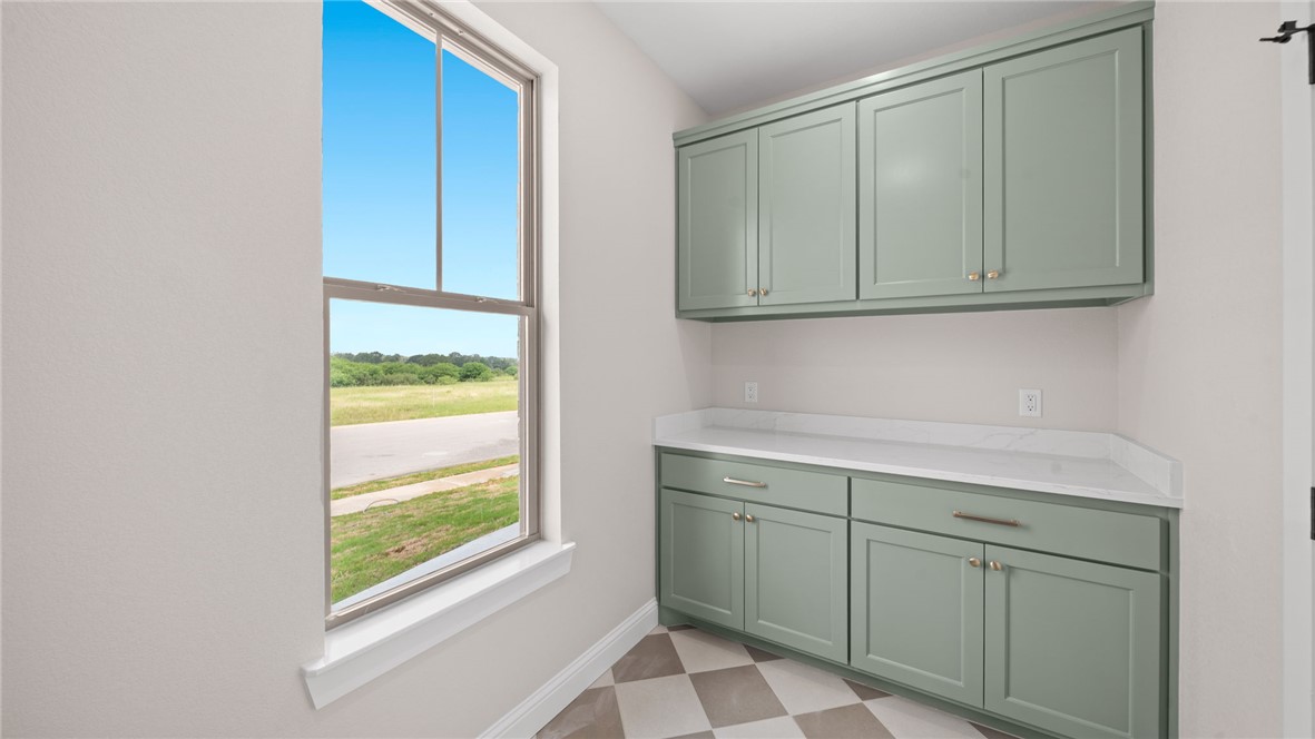 162 Buffalo Rdg Road Giddings, TX 78942 - Photo 19 of 31 a room with a sink and cabinets