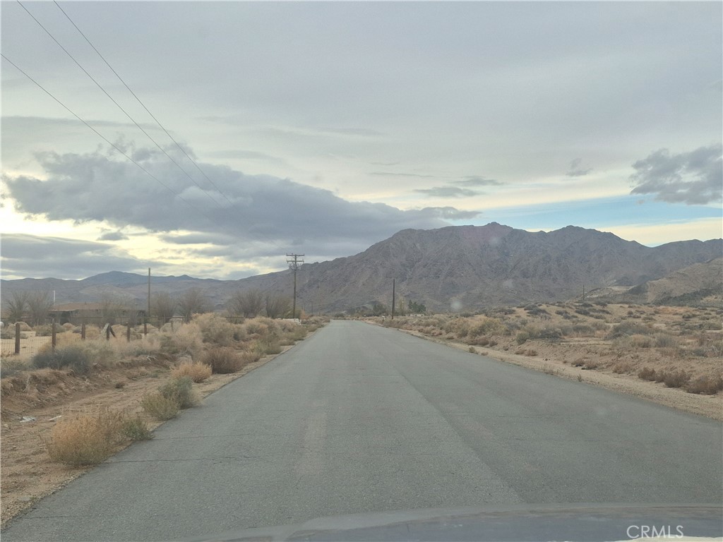 34143 Northside Road Lucerne Valley, CA 92356 - Photo 5 of 5 a view of a dry yard and mountains