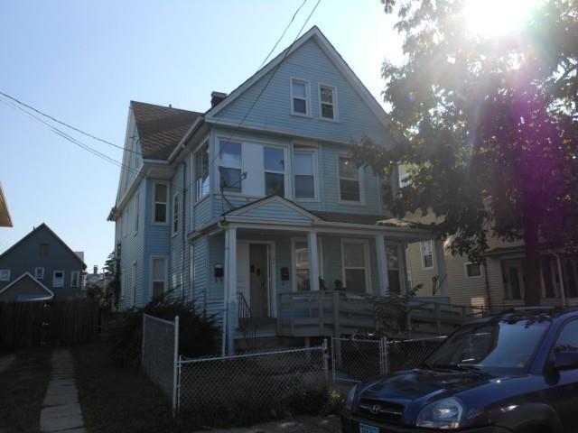 76 4th Street Bridgeport, CT 06607 - Photo 1 of 1 a front view of a house with yard