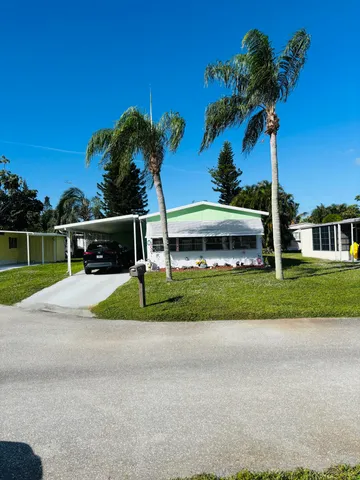a view of house with outdoor space and street view