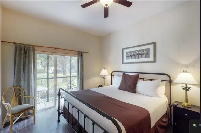 a bedroom with a large bed and a couch