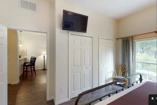 a view of a livingroom with furniture and a window