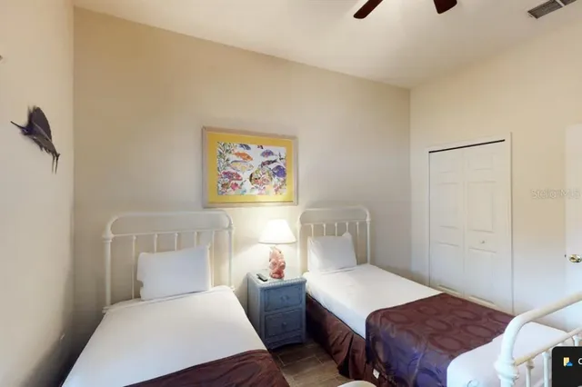 a bedroom with a bed and lamp