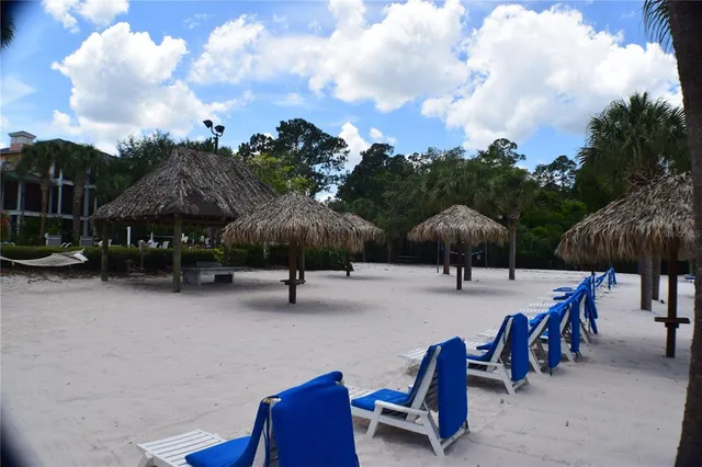 an outdoor space with patio lots of furniture and umbrella