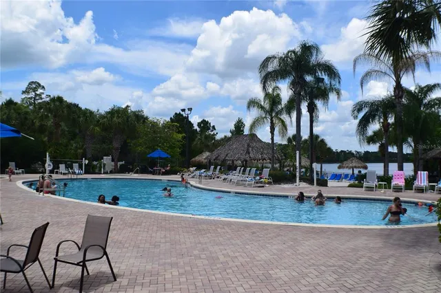 a view of swimming pool with outdoor seating