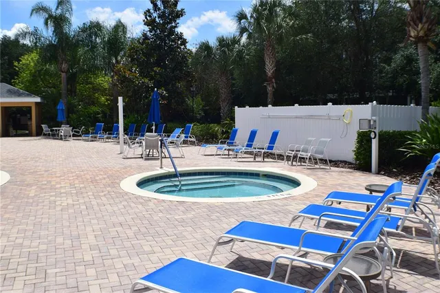 a view of a swimming pool with a patio