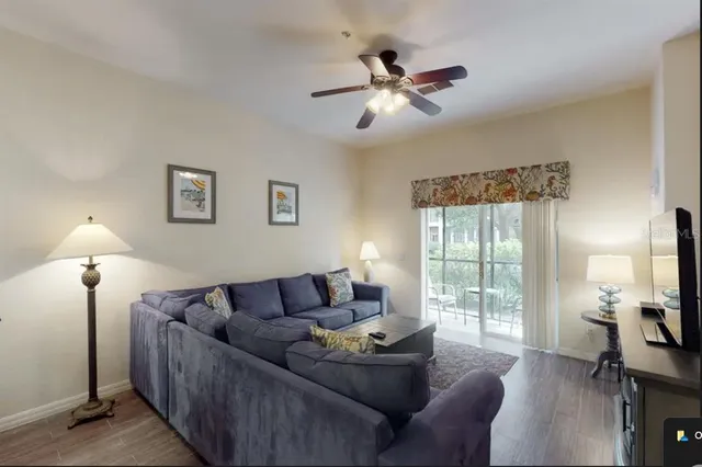 a living room with furniture and a window