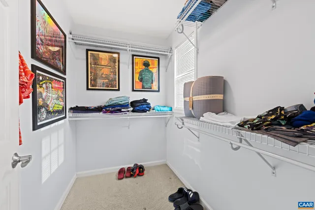 a bathroom with a double vanity sink mirror and toilet
