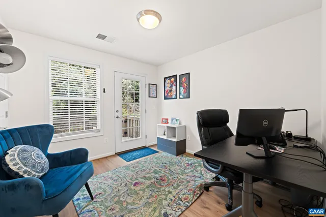 a view of balcony with wooden floor