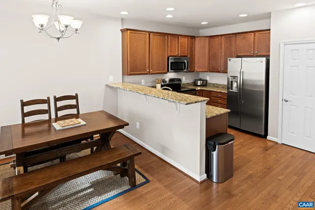 a kitchen with a sink stove and microwave