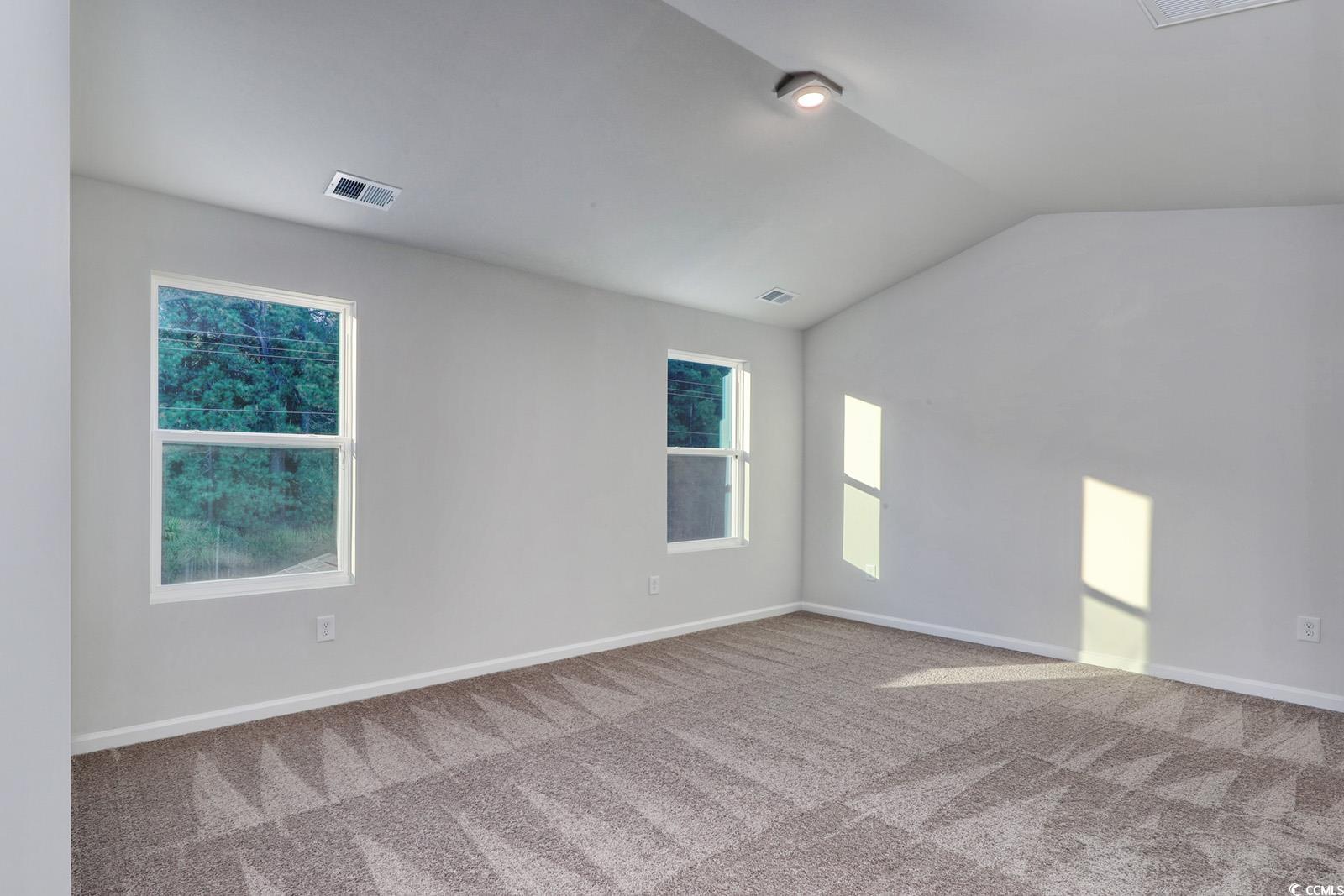 1121 Hainer Place Drive Conway, SC 29526 - Photo 11 of 28 Carpeted spare room featuring lofted ceiling and baseboards