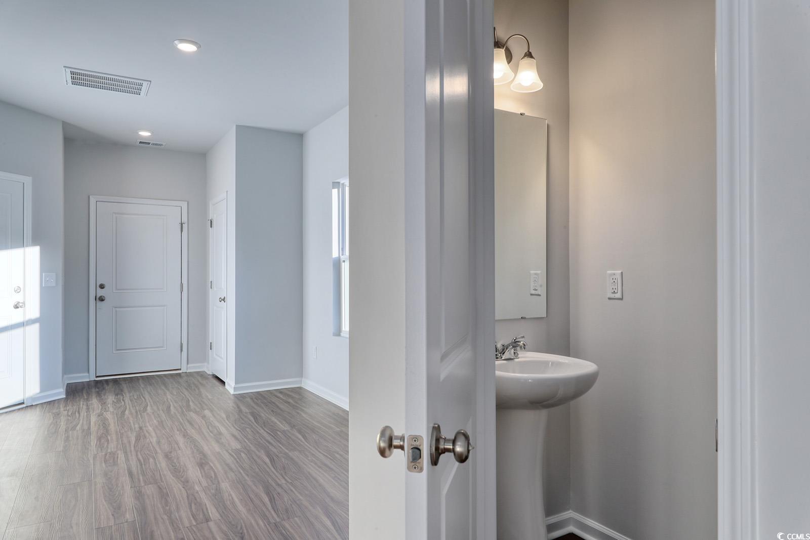 1121 Hainer Place Drive Conway, SC 29526 - Photo 24 of 28 Bathroom featuring wood finished floors and recessed lighting