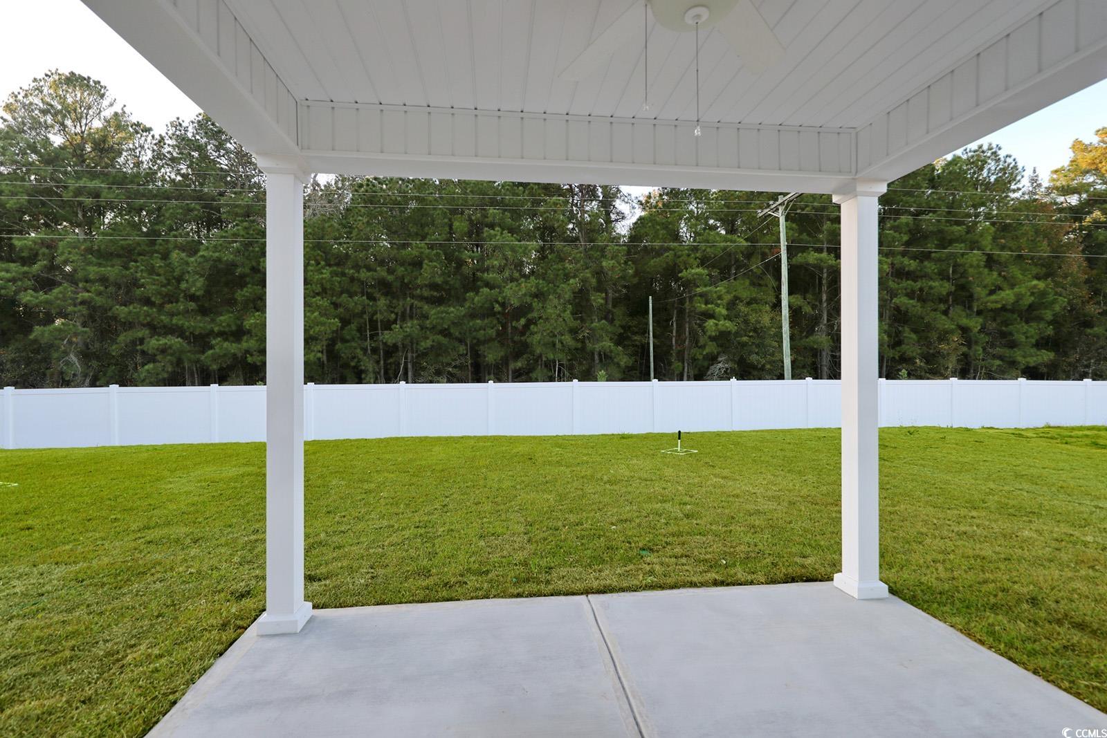 1121 Hainer Place Drive Conway, SC 29526 - Photo 25 of 28 Fenced backyard featuring ceiling fan and a patio