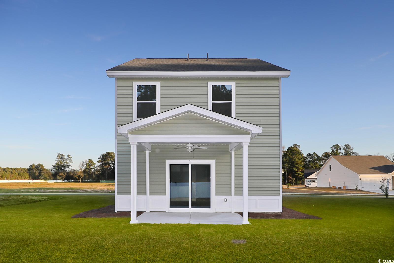 1121 Hainer Place Drive Conway, SC 29526 - Photo 27 of 28 Rear view of property with a yard and ceiling fan