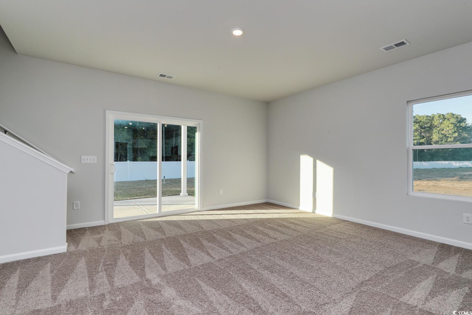 1121 Hainer Place Drive Conway, SC 29526 - Photo 8 of 28 Spare room featuring plenty of natural light, light carpet, and recessed lighting