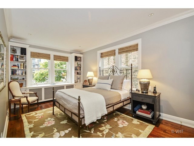 24 East Scott Street, Unit 3 Chicago, IL 60610 - Photo 7 of 10 a bedroom with a bed and a large window
