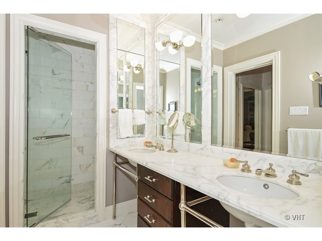 24 East Scott Street, Unit 3 Chicago, IL 60610 - Photo 8 of 10 a bathroom with a sink double vanity and a mirror